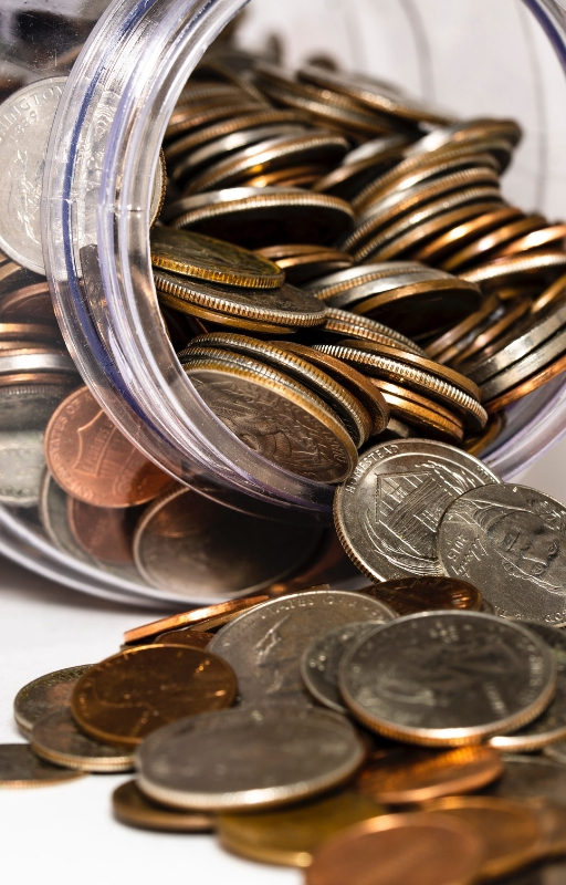 coins coming out of a fallen jar