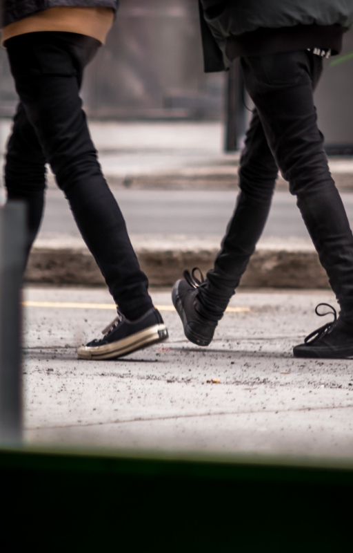 two people walking together in sync