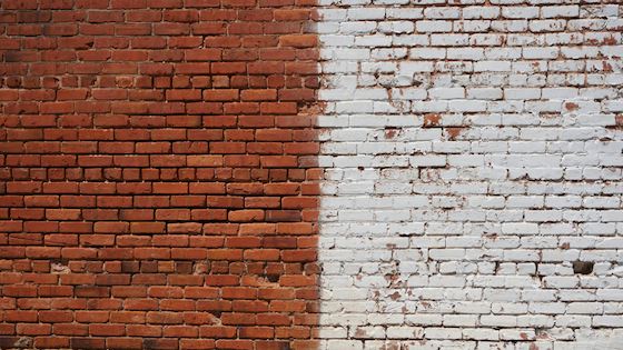 A wall painted red on left half and white on right half