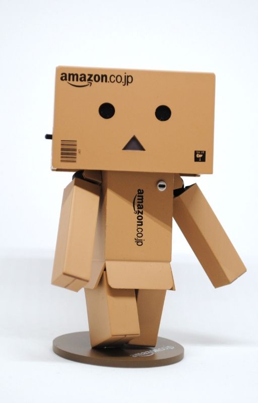humanoid made using cardboard boxes and AWS written on it