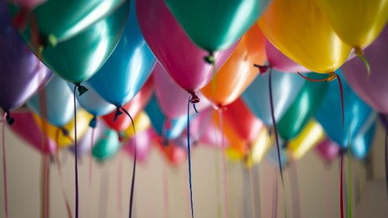 different coloured balloons flying