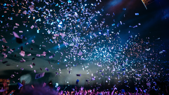 Colourful paper pieces flying in the night sky