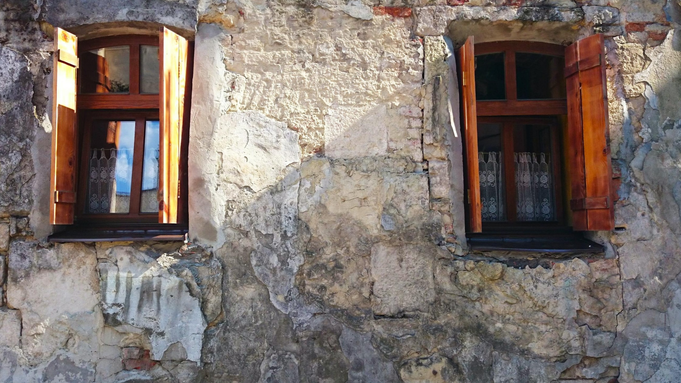 two open windows on a wall