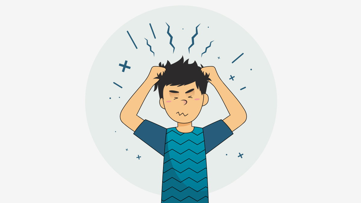 A boy holding his hair, having annxiety