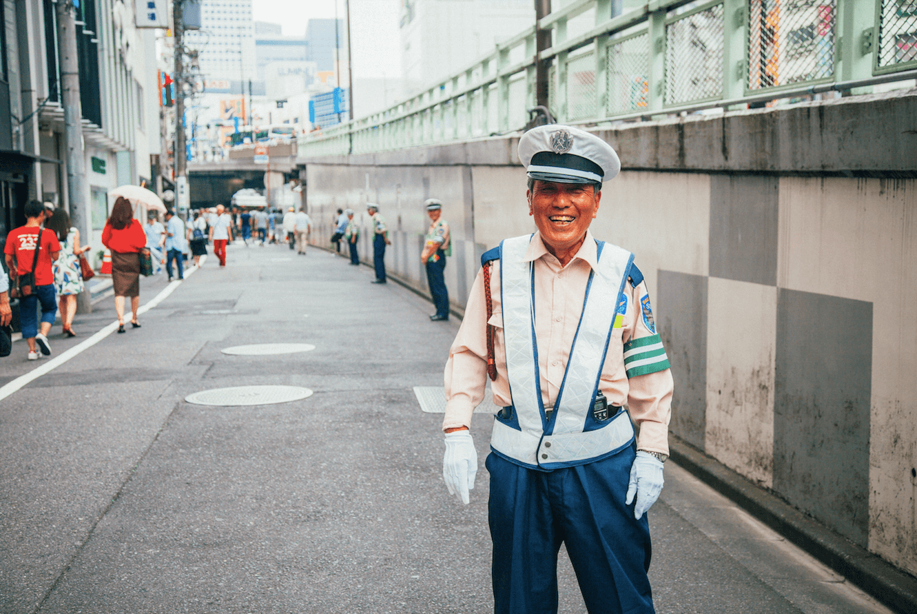 A security guard posing for the camera in a broad daylight