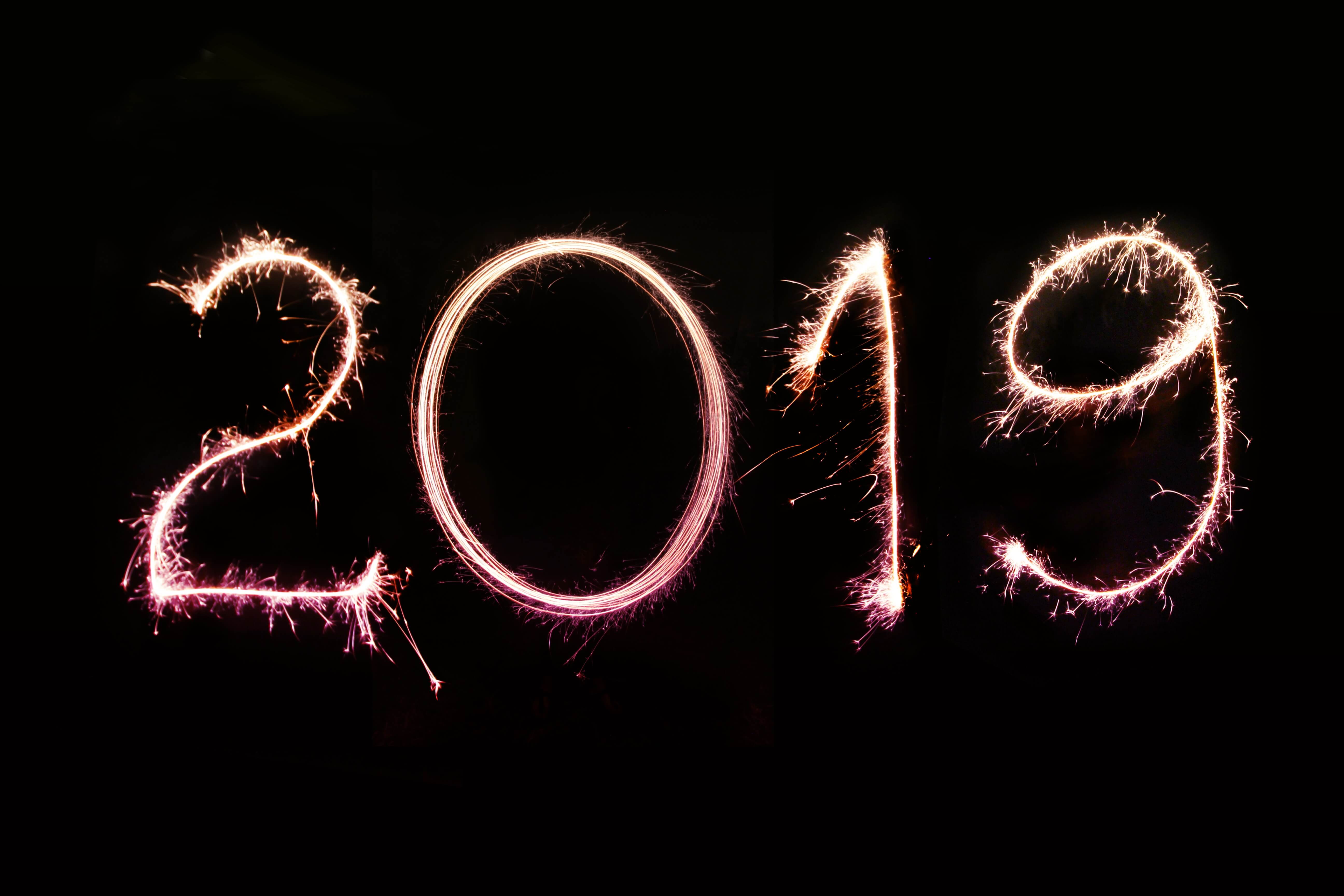 2019 written in orange amidst a black backdrop