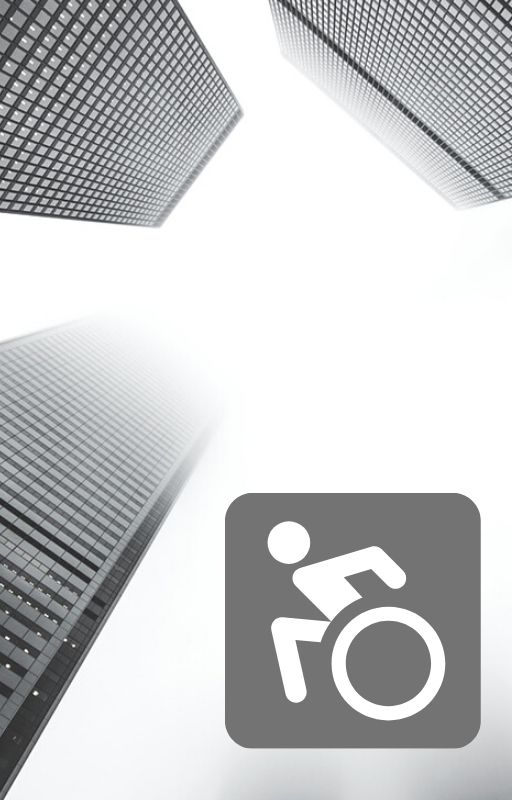 Grey skyscrapers with an animated wheelchair bound person in the bottom right corner