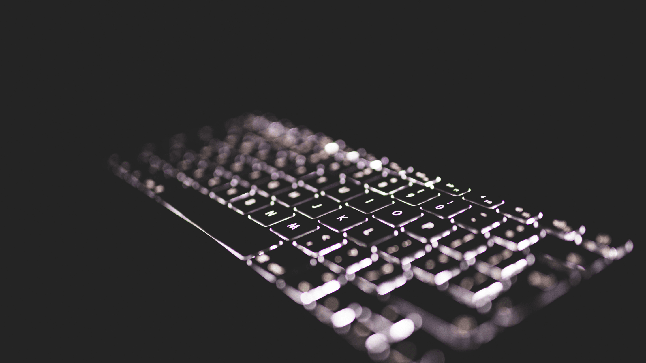 black and white picture of a backlit keyboard
