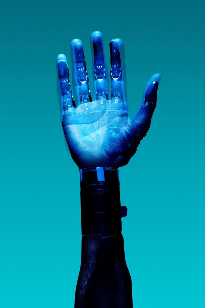 A robotic hand can be seen.
