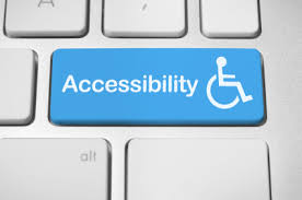 a white keyboard with blue key on which accessibility is written and a stick man in a wheelchair on right