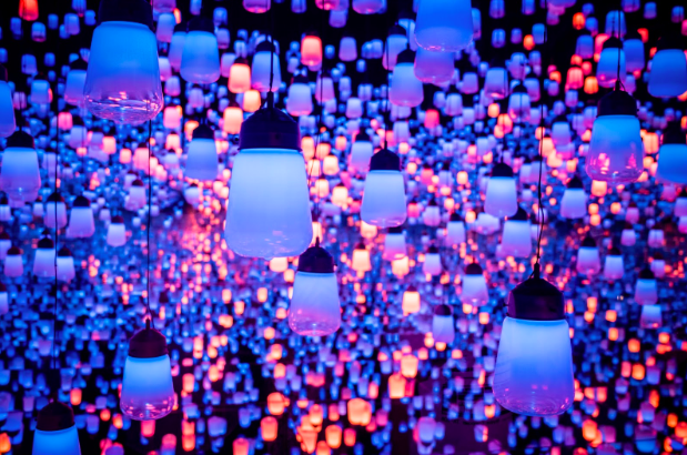 Image representing a clustered series of lights hanging with the walls in  blue, pink and orange colours