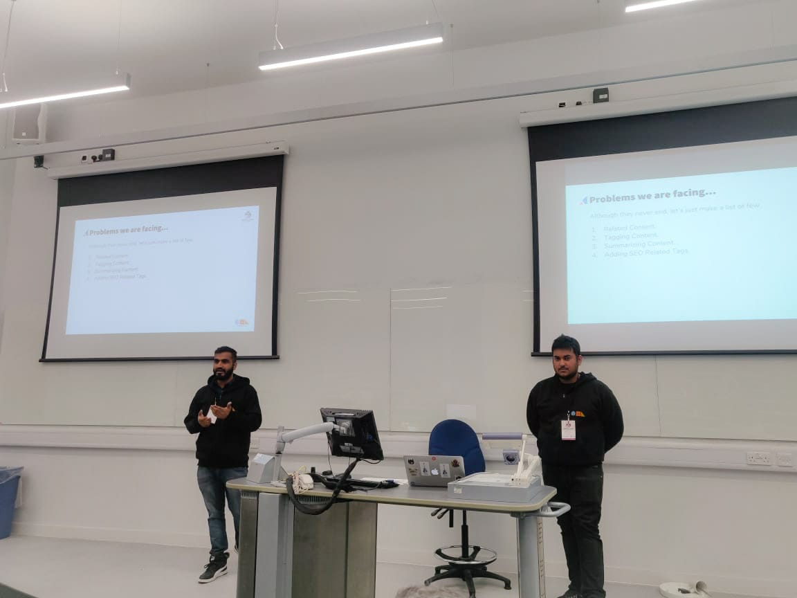 team presenting a session at Drupal camp London