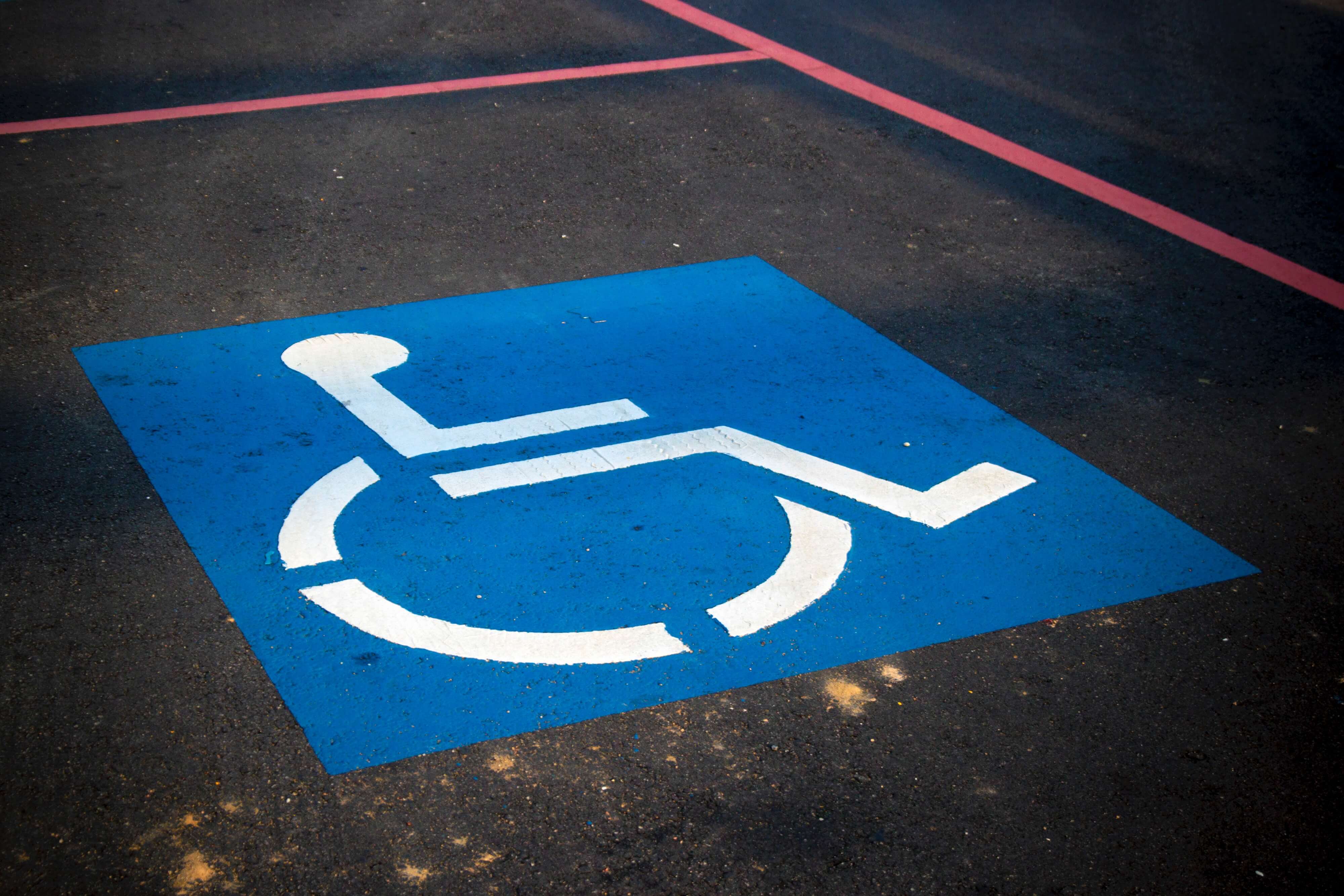 A wheelchair symbol drawn on road for accessibility awareness