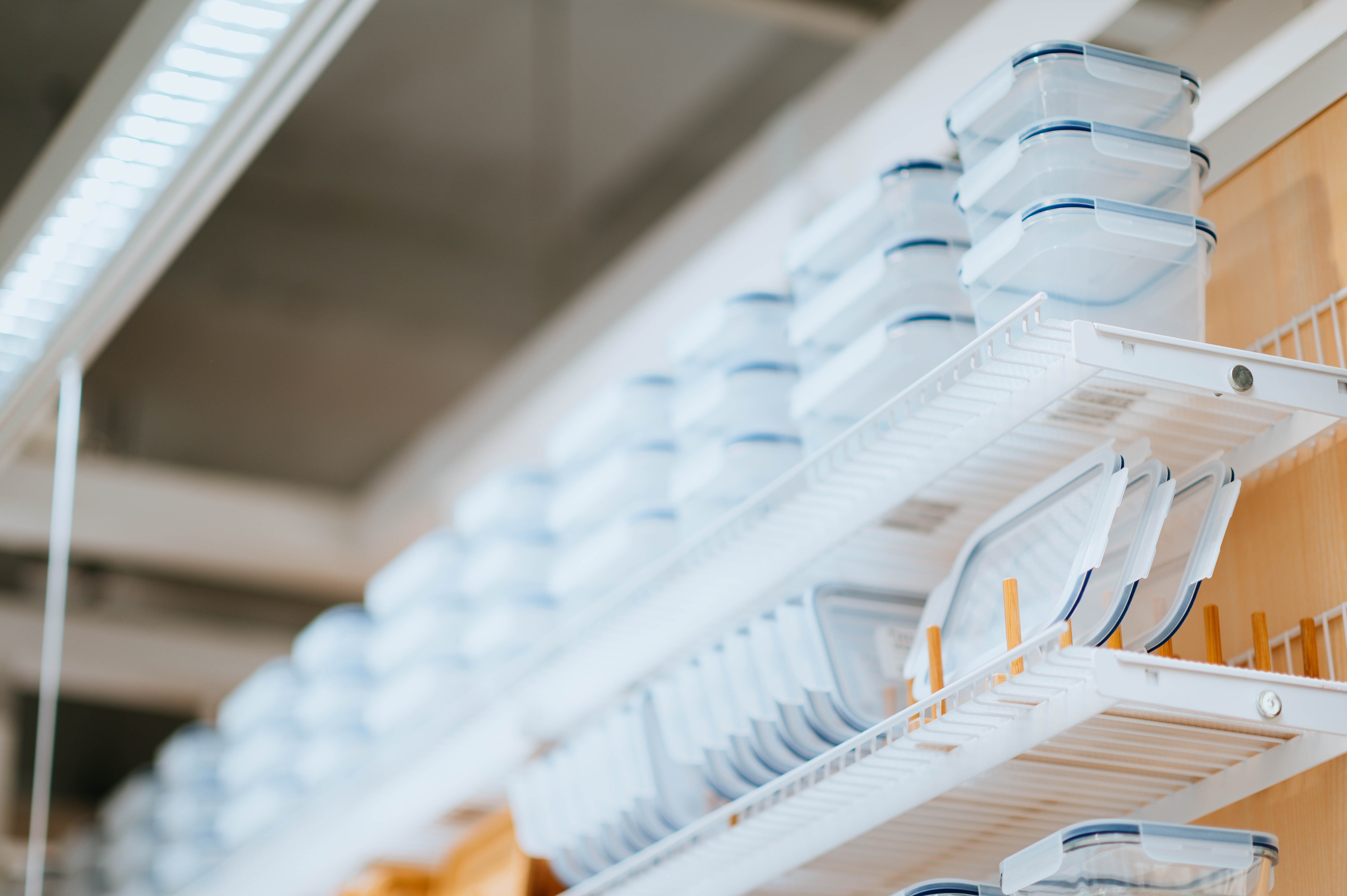 illustartion image showing on a white plastic containers on a white and brown rack to portray serverless architecture