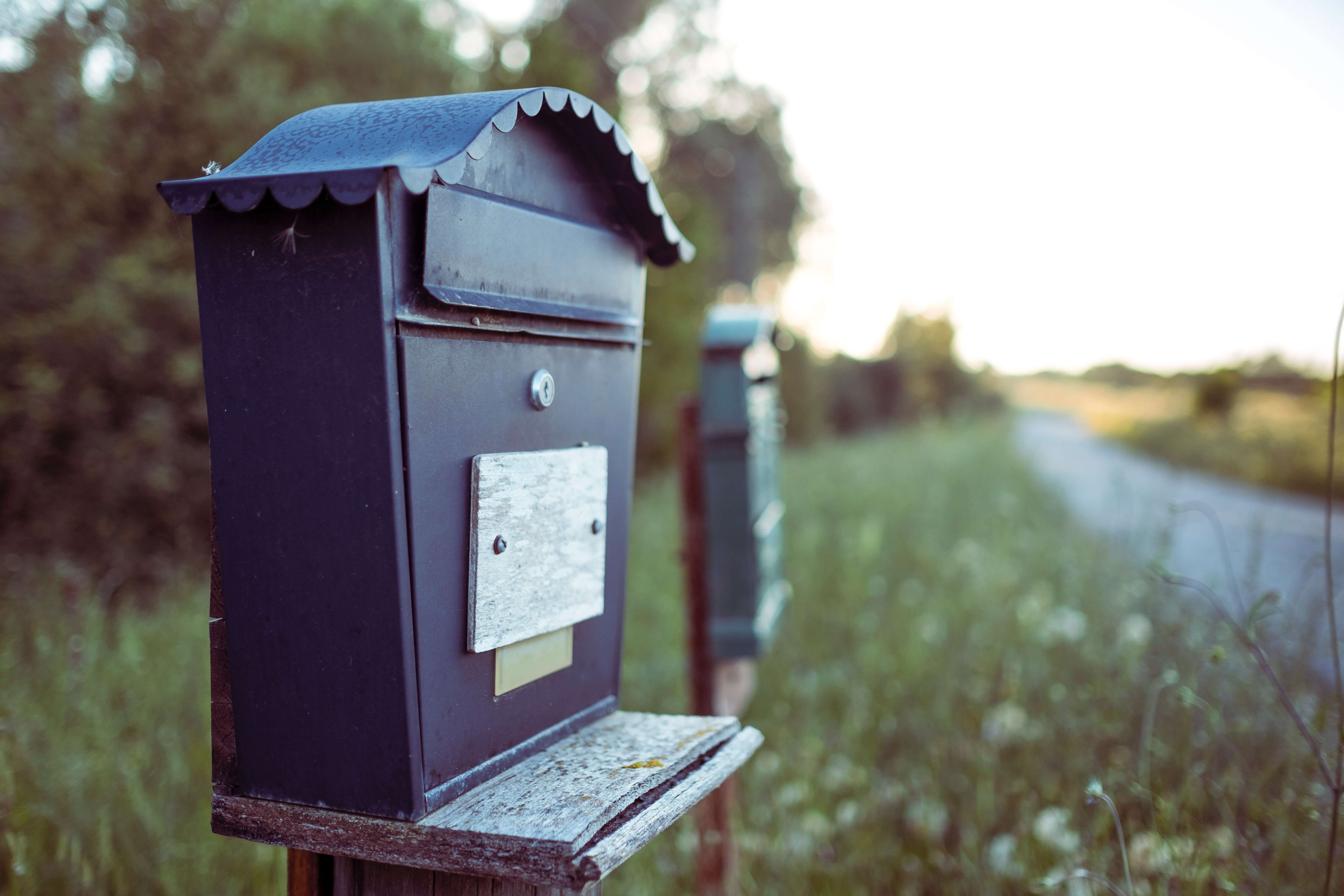 blue mail box in the lawn