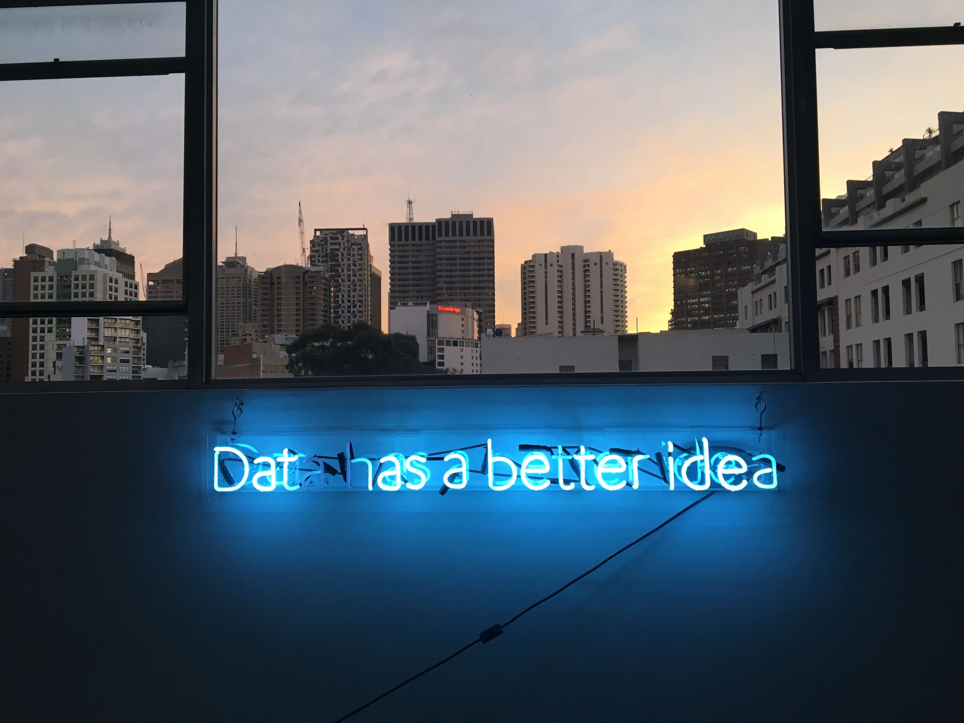 text 'Data has a better idea' in blue neon lights