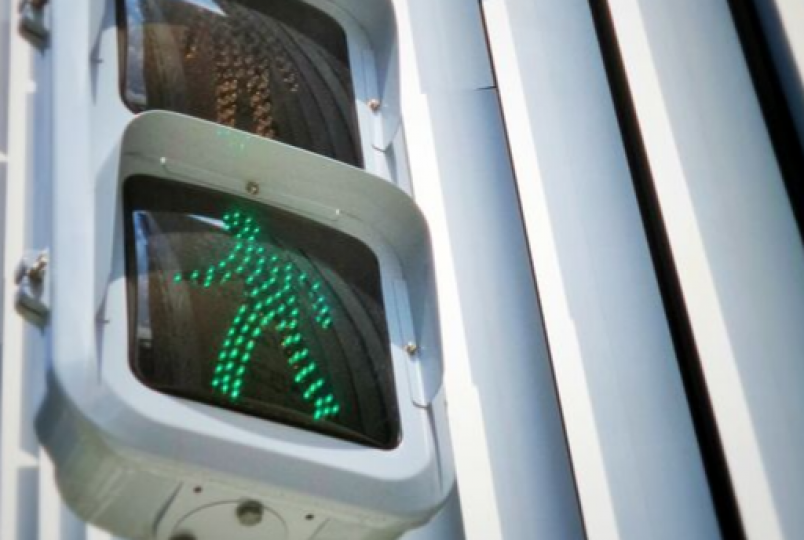 illustration image showing green traffic light and white building in behind
