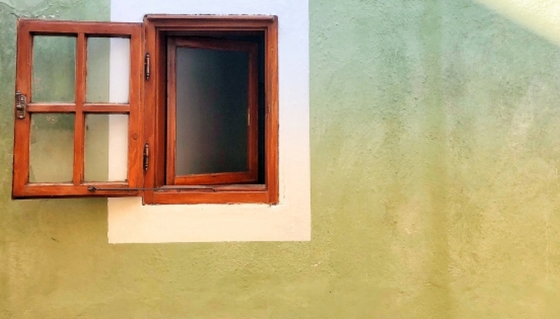 an open window outside a wall