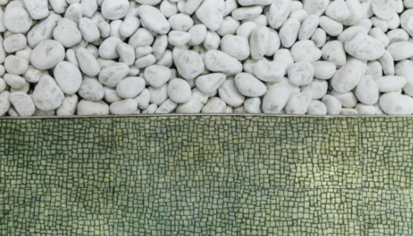 Half white pebbles, half green tiles
