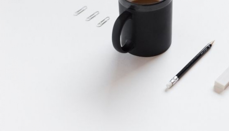 A mug, pencil and an eraser on a white background