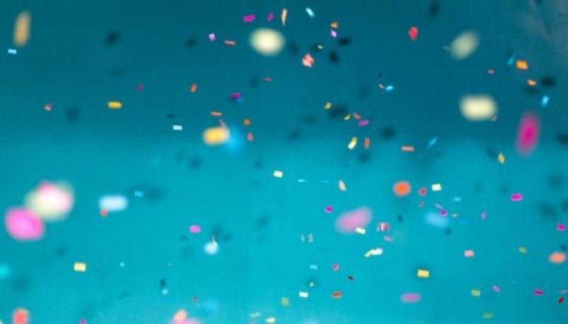 confetti all over against light blue background 