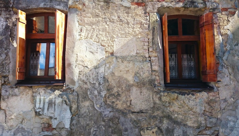 two open windows on a wall