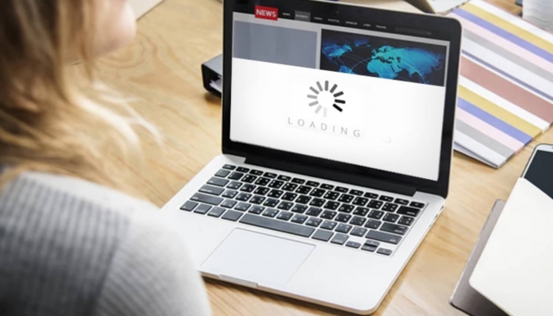 A person working over a laptop