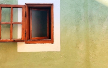 an open window outside a wall