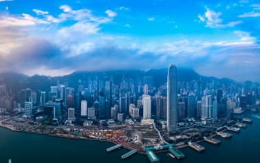 Panoramic view of a city with sky scrapers and blue sky