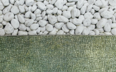 Half white pebbles, half green tiles