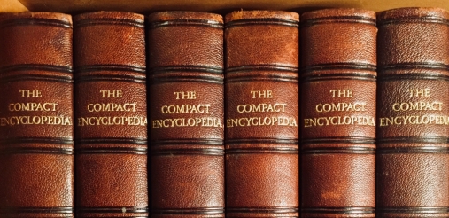 six brown cover encyclopedia arranged vertically