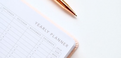 a planner and a pen 