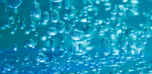 Water droplets on blue background