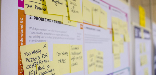 Yellow colored post-it on wall