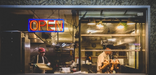 front view of restaurant with open written on the door