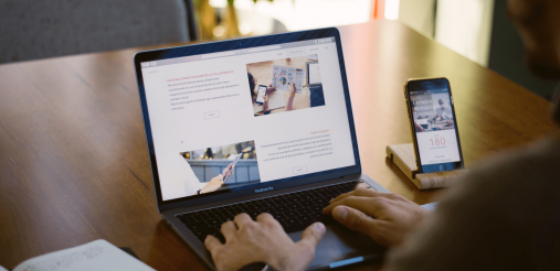 An image describing a man working on a laptop