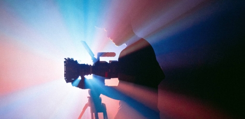 An image displaying a person with a camera