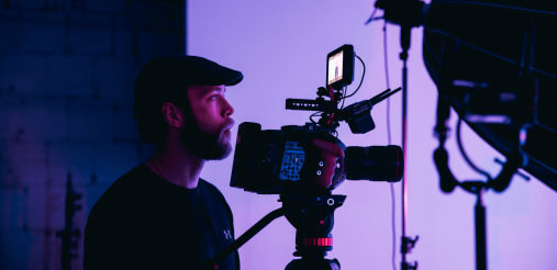 An image displaying a person with a camera
