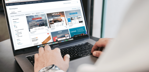 An image displaying a person working on a laptop