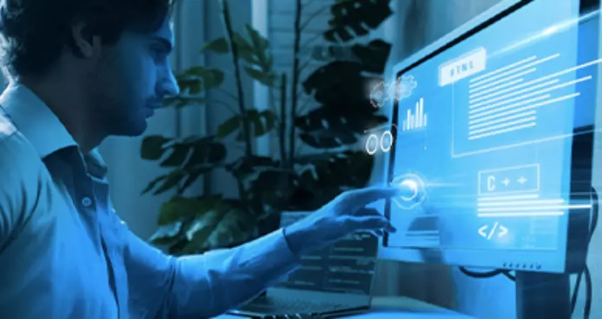 a man is shown touching the screen of a desktop